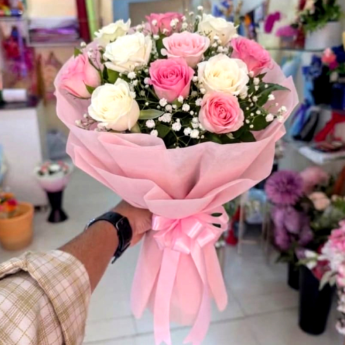 pink and white roses bouquet with baby breath